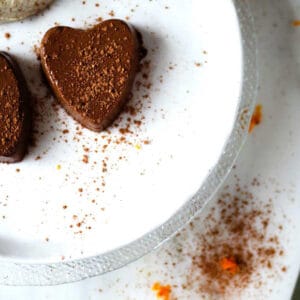 A chocolate orange semifreddo heart with cacao and orange zest sprinkles