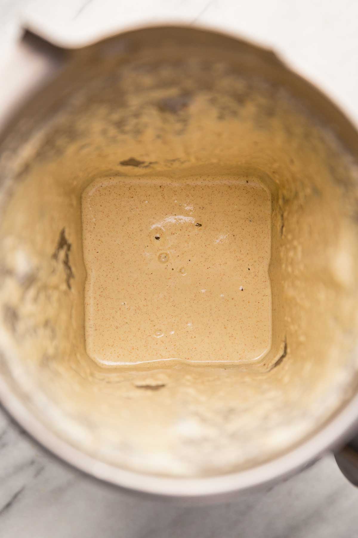 Blended creamy ingredients for making vegan chocolate rosemary truffles.