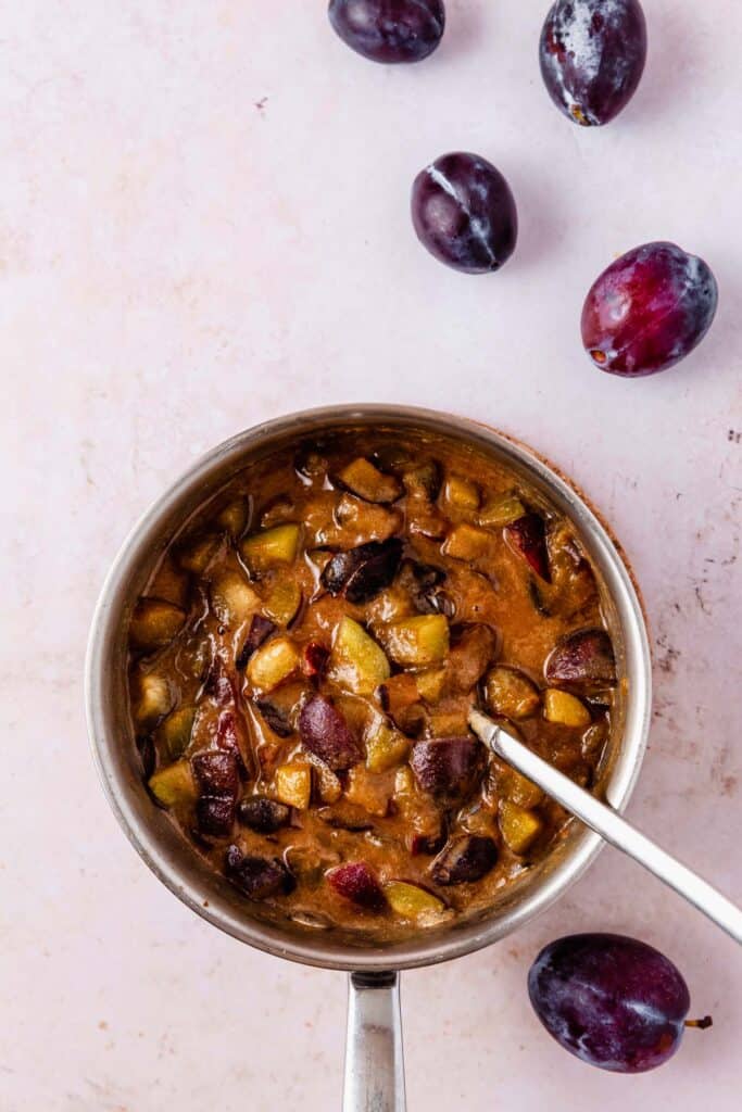 a pot of spiced-plum jam ingredients