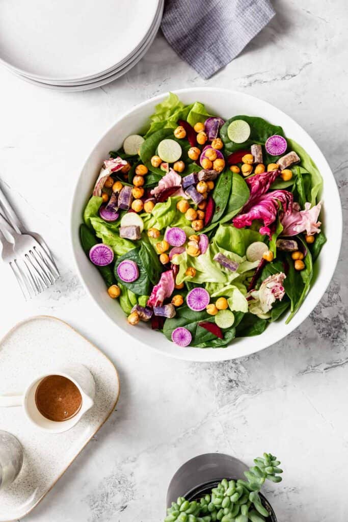 colorful salad with tahini-balsamic dressing on the side