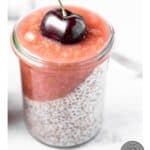 A pinterest graphic for rhubarb ginger compote, picturing it on a chia pudding parfait topped with a fresh cherry.