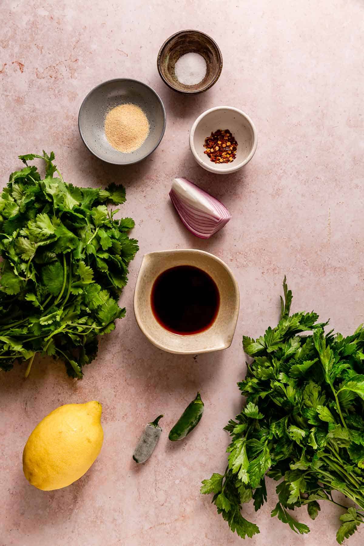 Top down view of ingredients required to make Beautiful Ingredient's chimichurri verde.