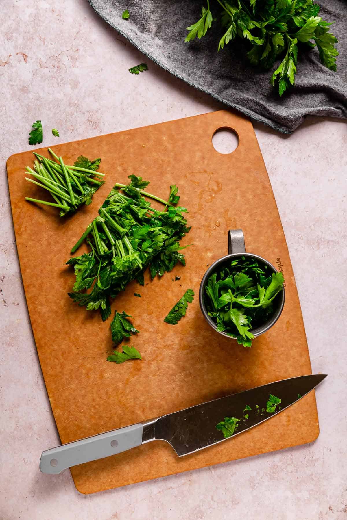 Chopped parsley on a cutting board.