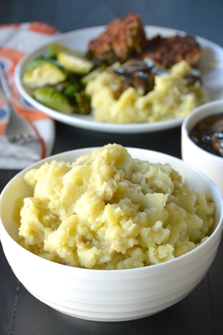 A bowl filled with vegan mashed potatoes that were made quickly in the Instant Pot.