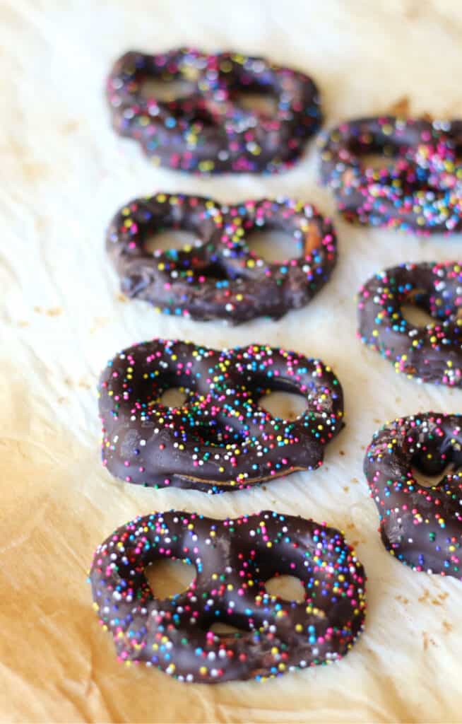 Chocolate covered pretzels with rainbow sprinkles