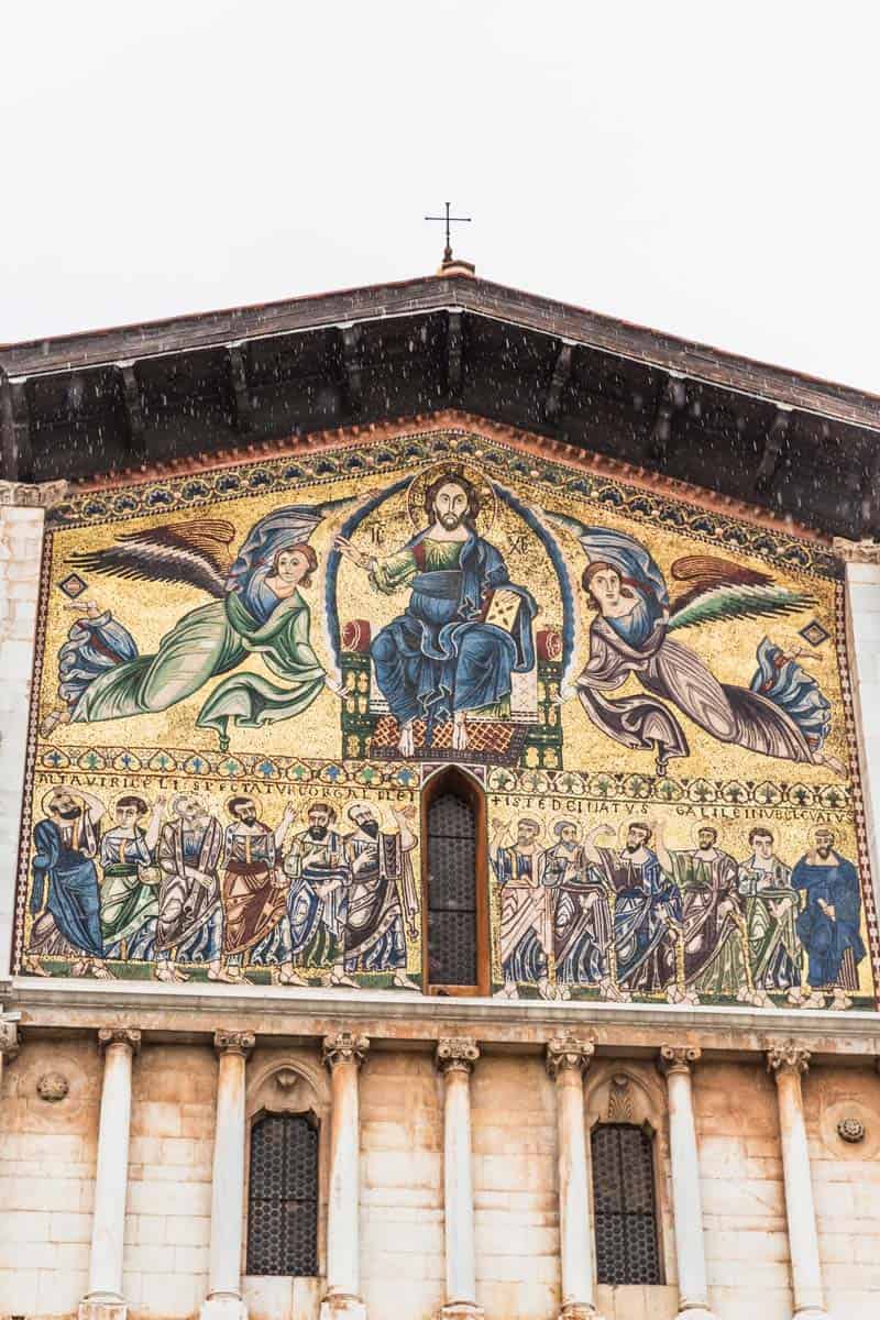 Golden church facade in Lucca, Italy.