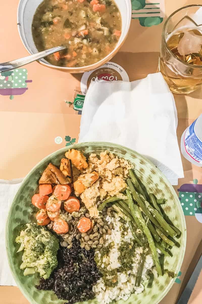 A cup of soup and buddha bowl lunch in Lucca, Italy.