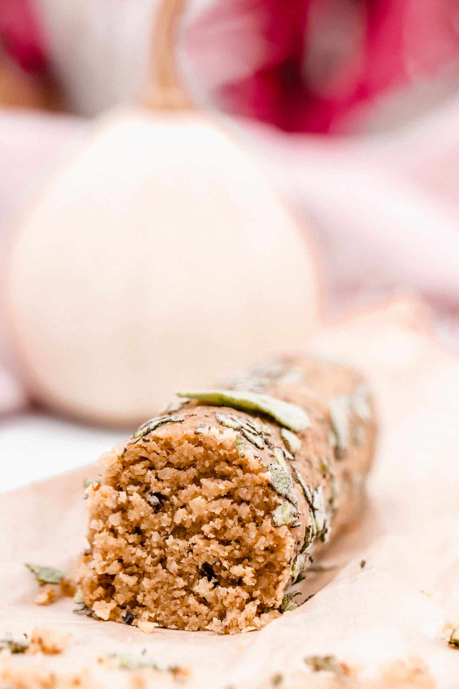 A vegan cheese log made of brazil nuts for a Thanksgiving appetizer.