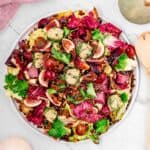 An overhead view of colorful Vegan Harvest Salad with Pecan Dressing.