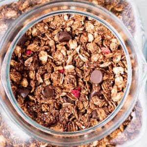 Chocolate berry granola in a large jar.