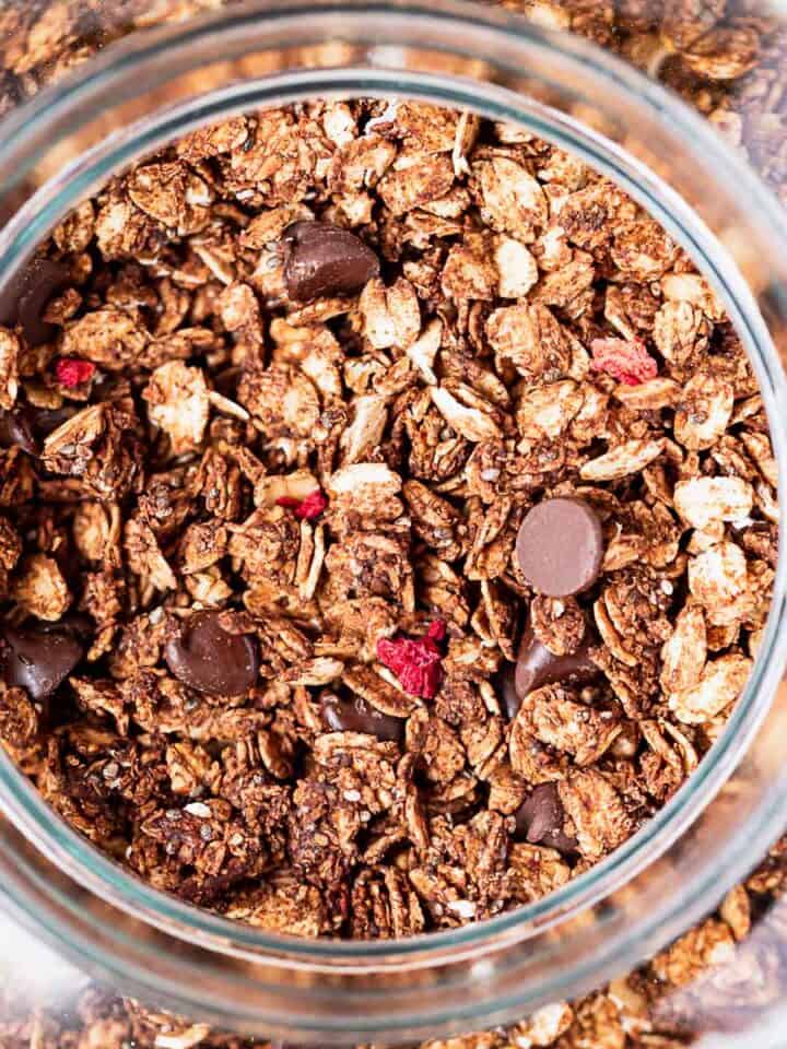 Chocolate berry granola in a large jar.