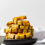 a stack of roasted delicata squash slices