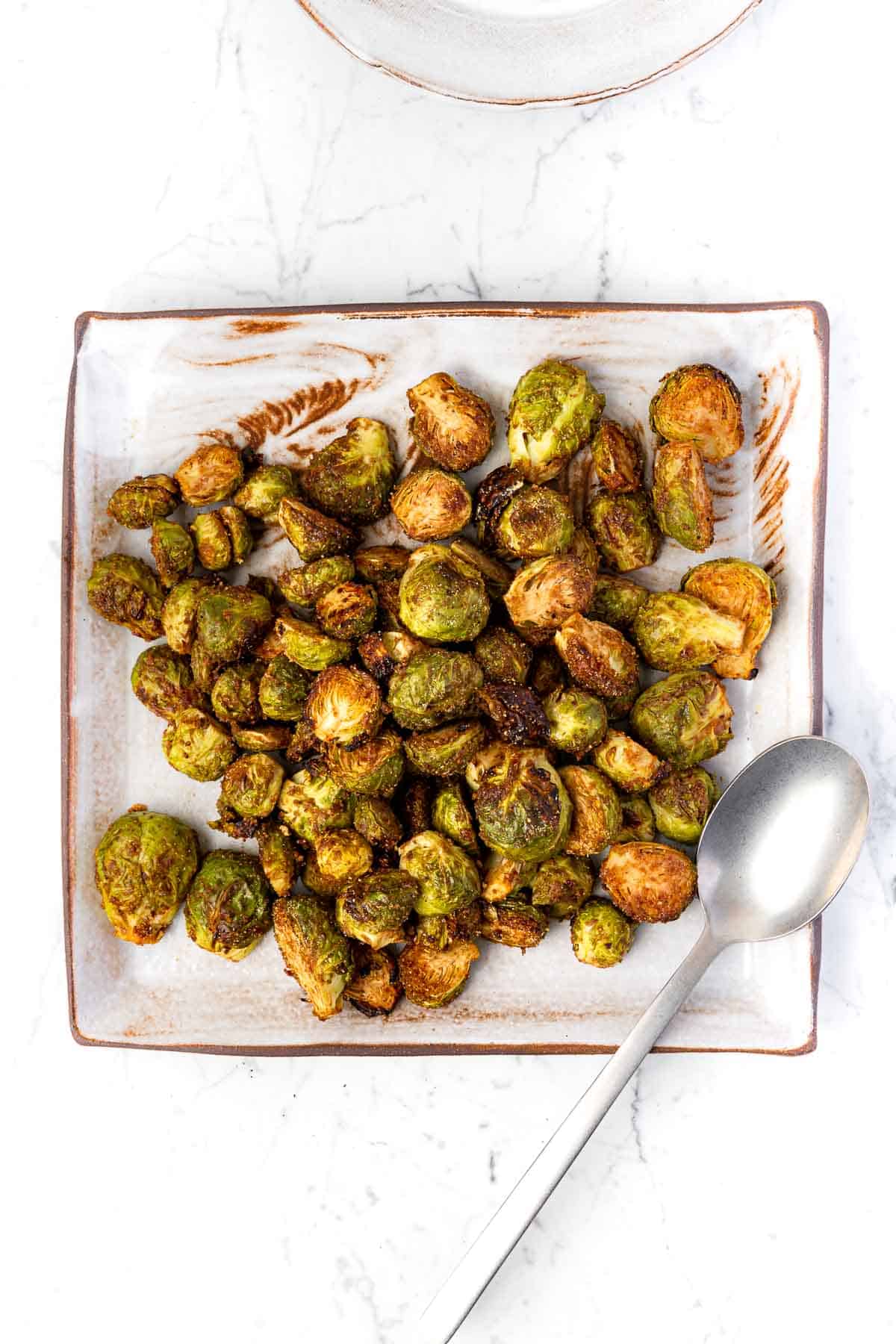 A plate of Maple Balsamic Roasted Vegan Brussels Sprouts.