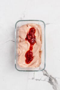 blended frozen bananas with strawberry rhubarb compote on top