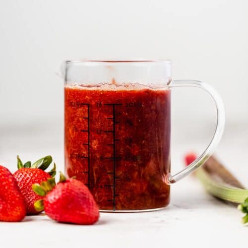 a pitcher of strawberry rhubarb compote