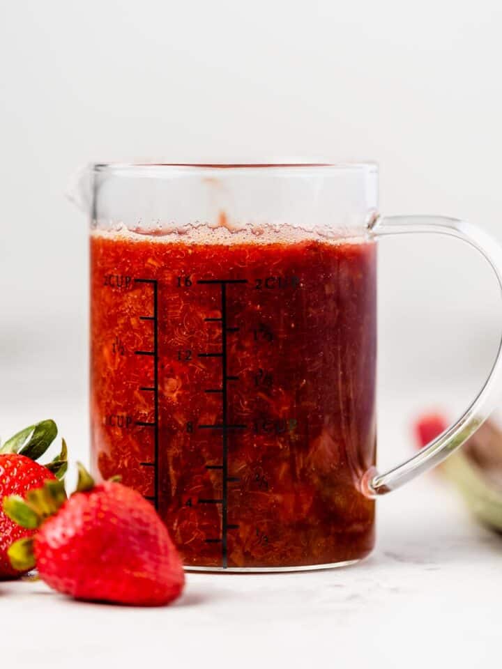 a pitcher of strawberry rhubarb compote
