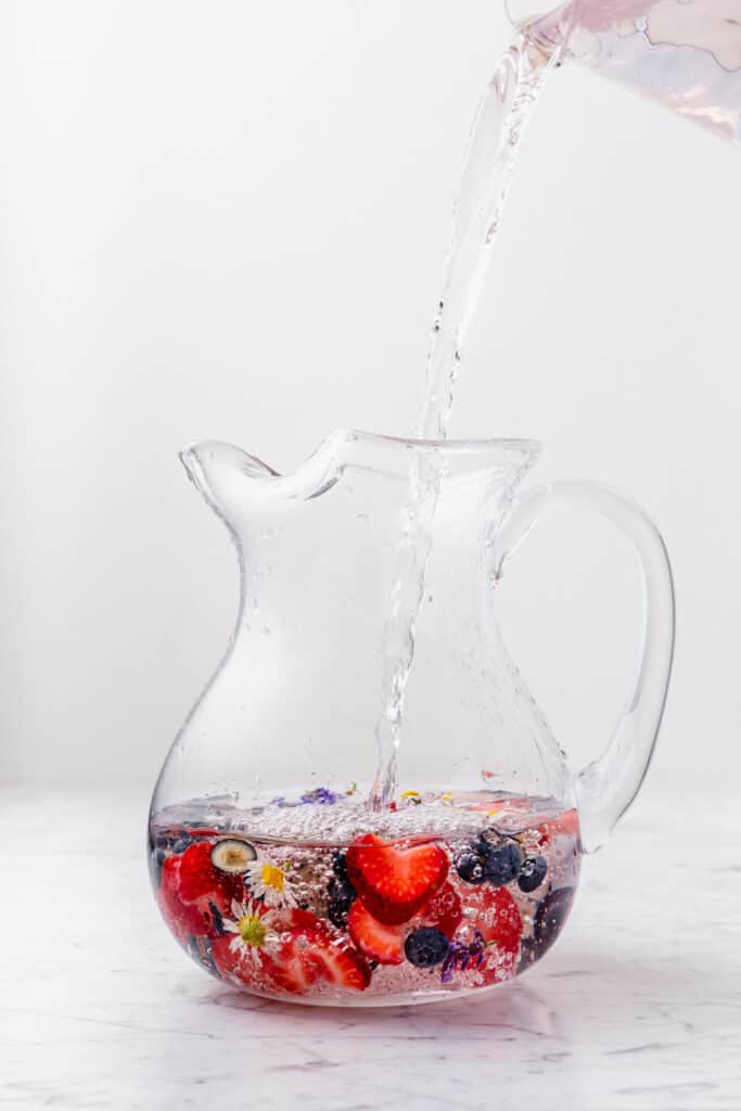 A pitcher of water infused with berries