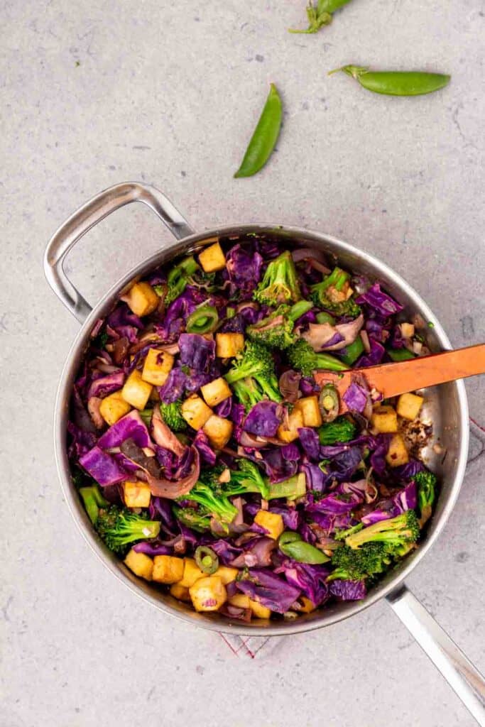 A pot filled with veggies and baked tofu