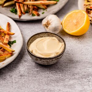 A small bowl of vegan lemon garlic aioli.