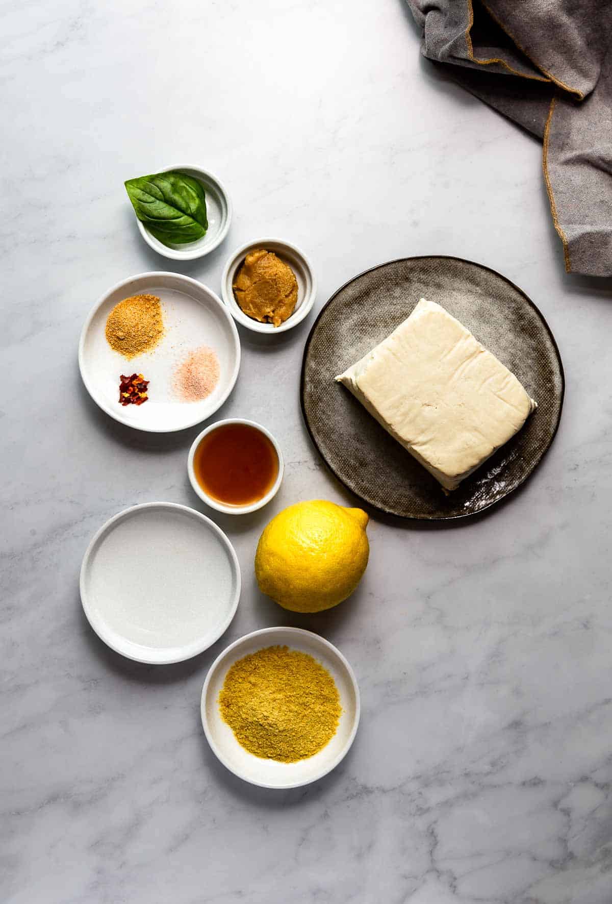 tofu-feta-ingredients on a marble surface.