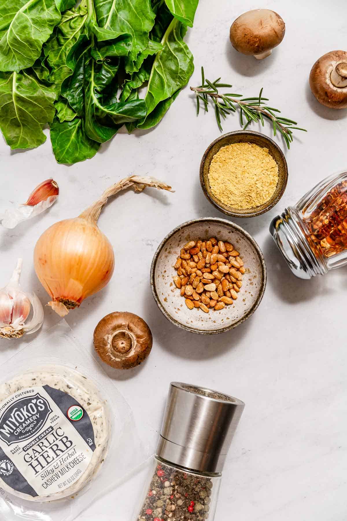 Toppings that can be added to the Easiest Vegan Lentil Bolognese, including greens, vegan cheeses, onion, mushrooms, pine nuts, herbs, and spices.