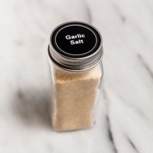 A jar filled with homemade garlic salt.