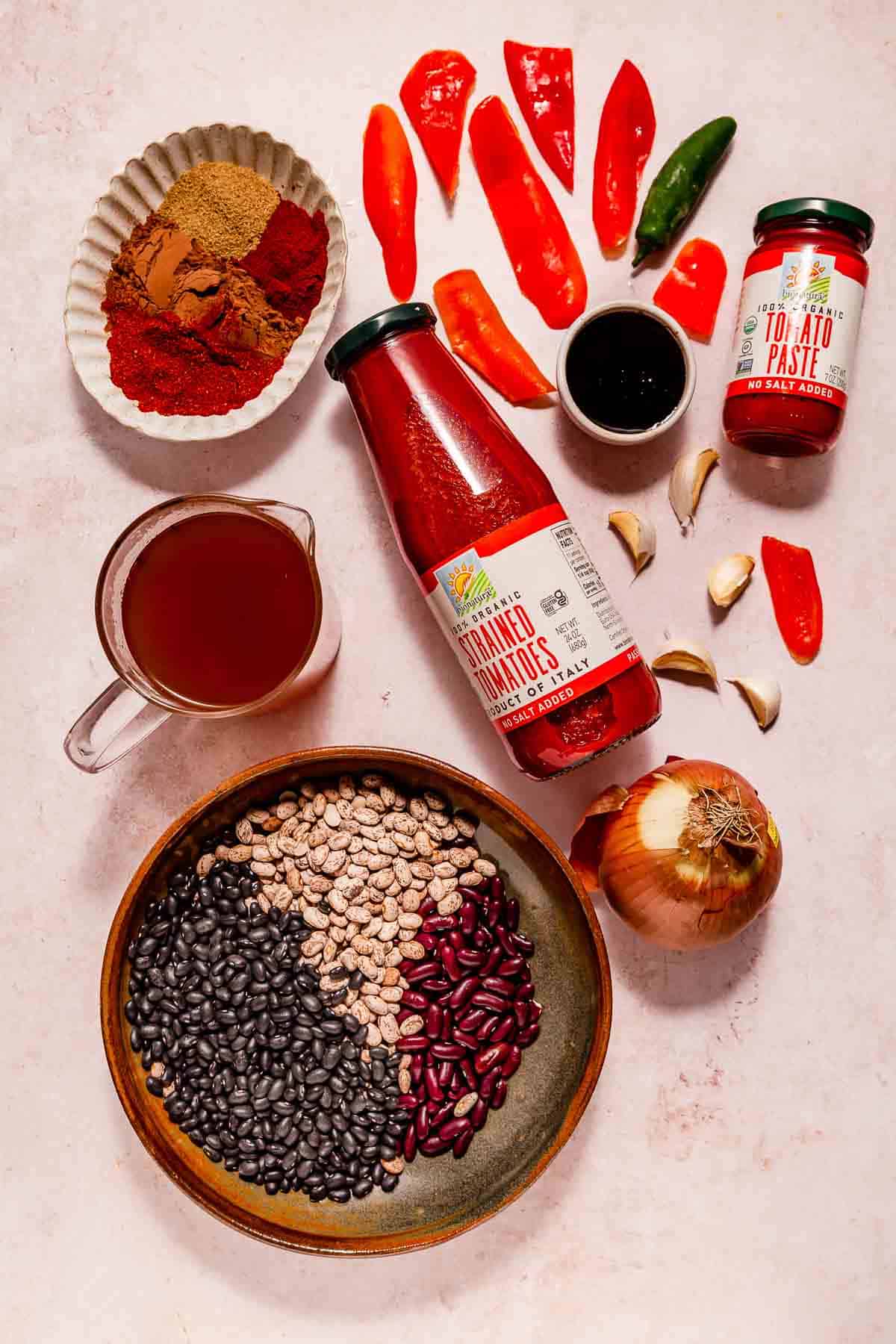 Ingredients for making vegan Instant Pot chili, including three different beans.