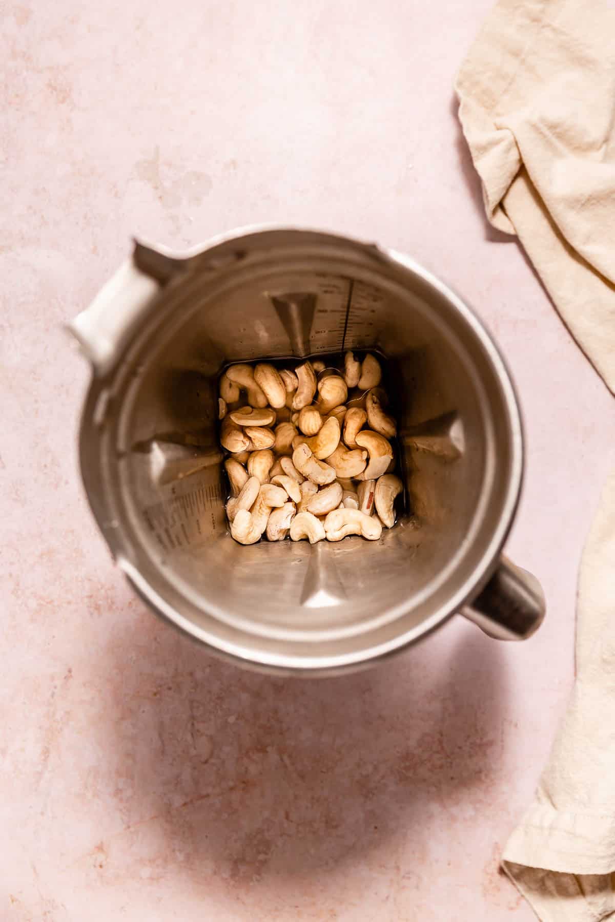 All ingredients for making vegan sour cream placed in a high-speed blender.