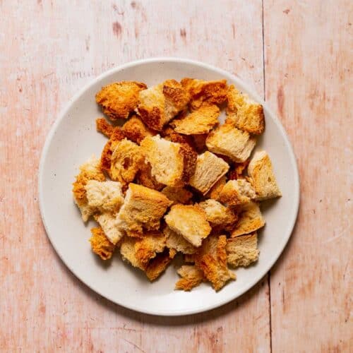 A plateful of golden sourdough croutons.