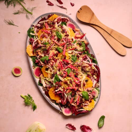 A beautiful, colorful vegan winter salad featuring radicchio, oranges, fennel, quinoa, and cannellini beans.